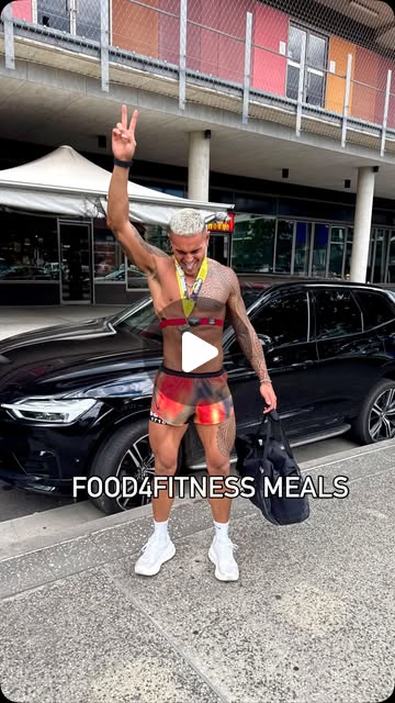 Athlete holding Food4Fitness meals outside in Sydney